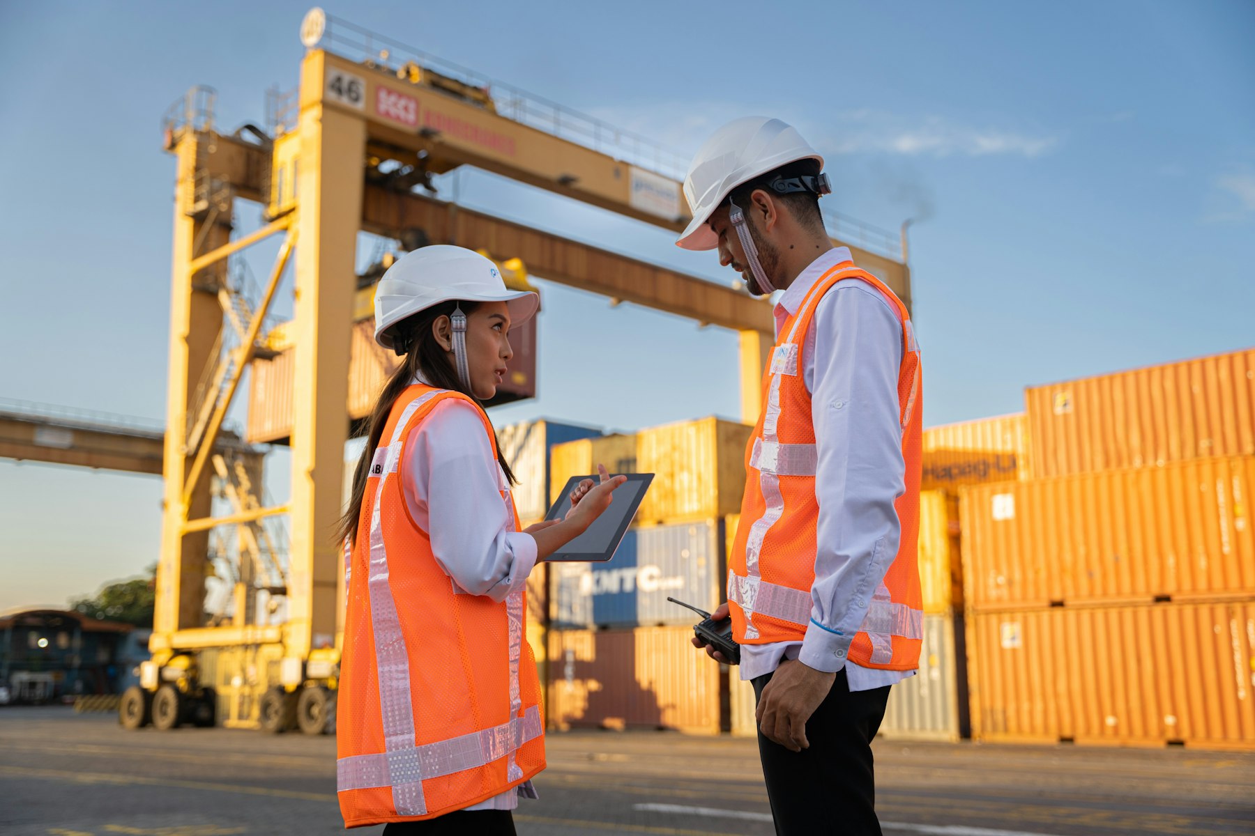 Inspectors checking shipment documents at a container terminal